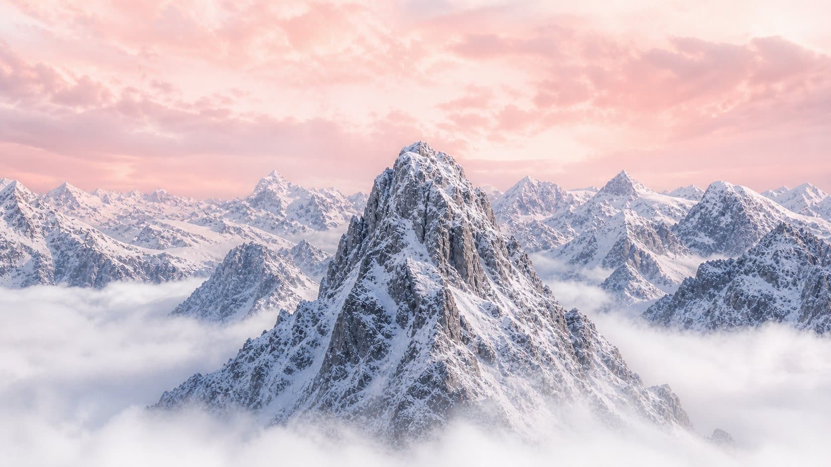 Snow-capped mountain peaks rising above clouds at dawn